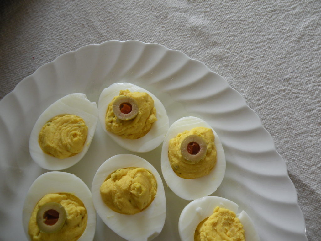 Deviled eggs on a white serving platter